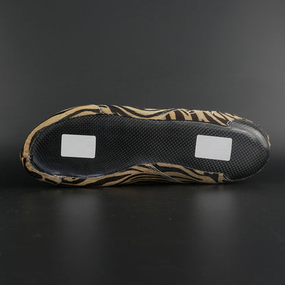 Skater wearing Envy Cow Zebra Print Style Roller Skates in motion