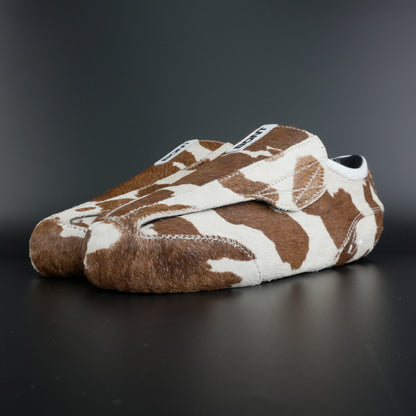 Angled view showing natural brown and white leather contrast
